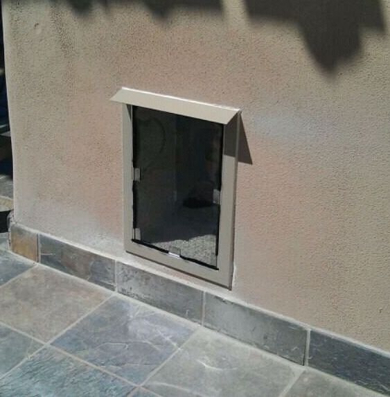 Install dog door outlet brick wall